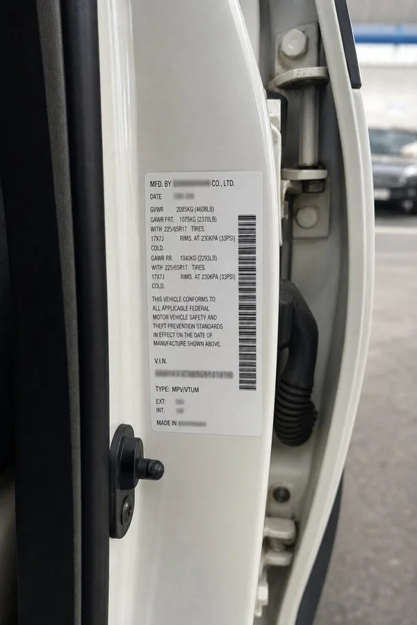 Vehicle information sticker on a door jamb
