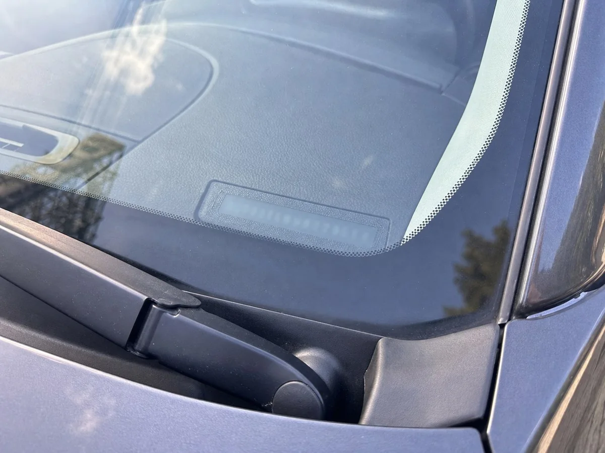 VIN plate visible through a windshield